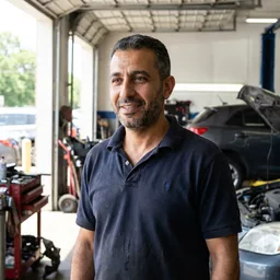 Sami A., auto repair workshop owner in Dubai